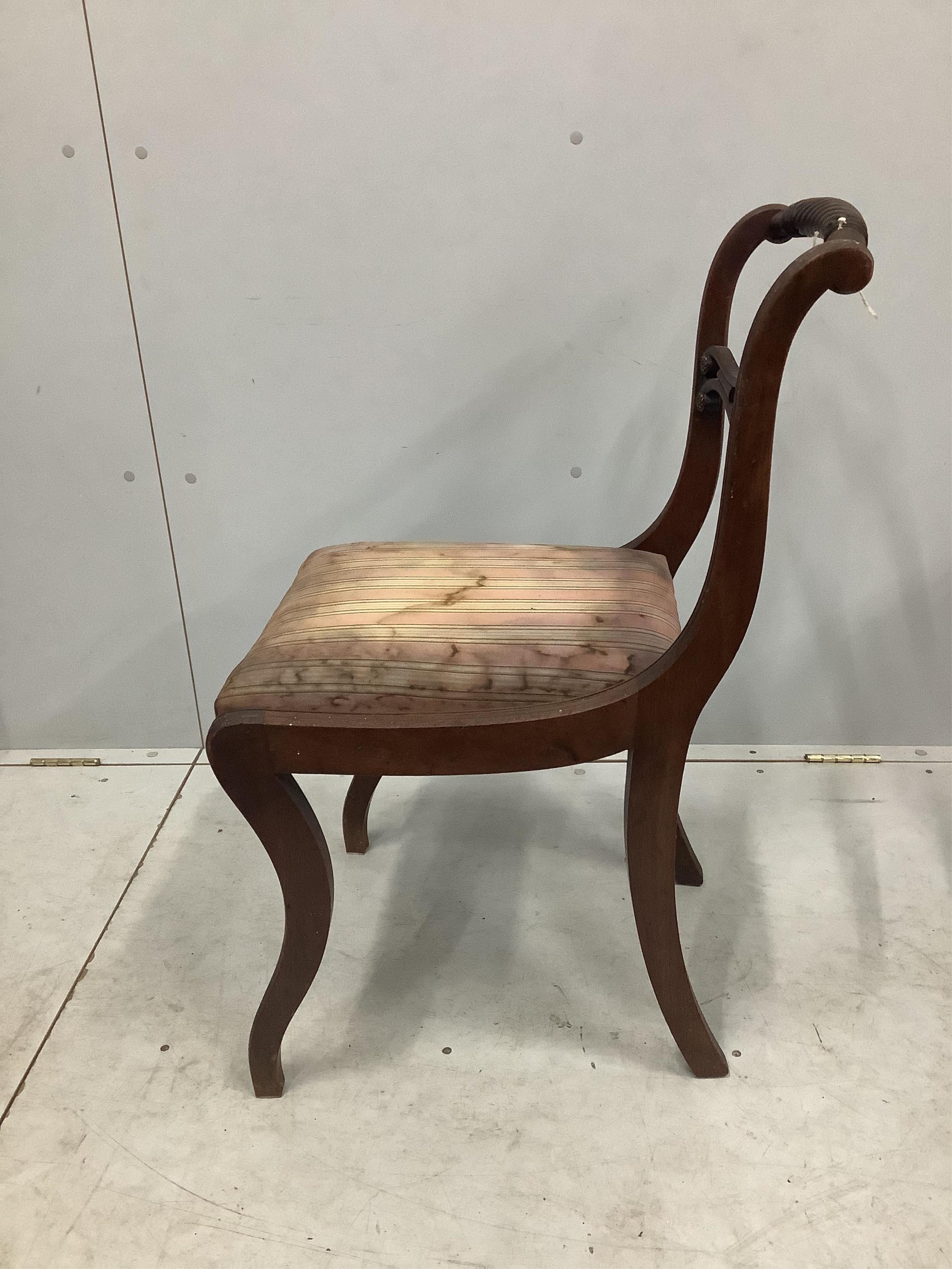 A set of eight Regency brass mounted mahogany dining chairs, one with arms. Condition - poor to fair, one lacking top rail